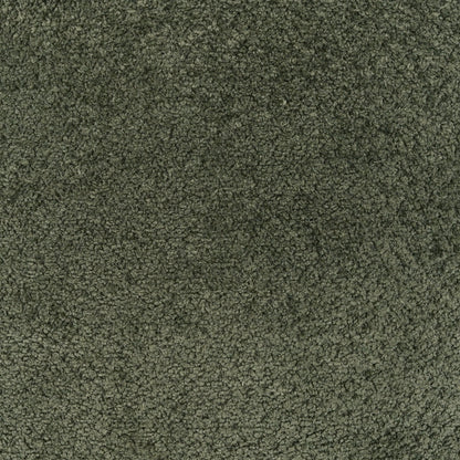 Olive green boucle fabric close-up on a textured pillow; knobby, fuzzy texture.