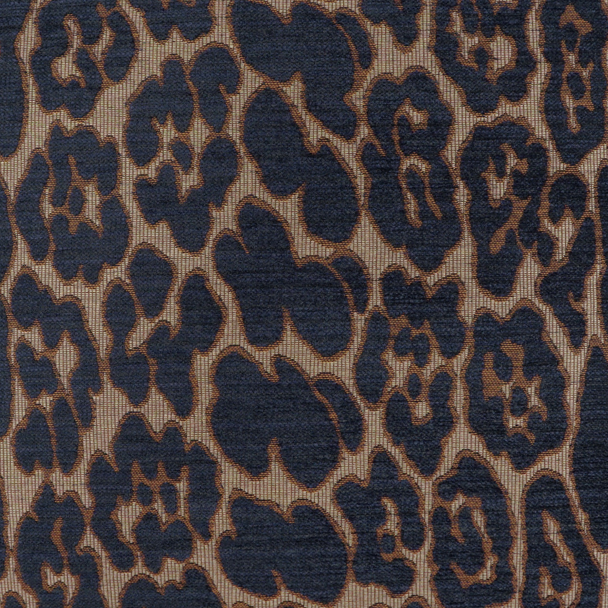Navy leopard-print woven fabric on tan backdrop; irregular rosettes; upholstery or drapery use.
