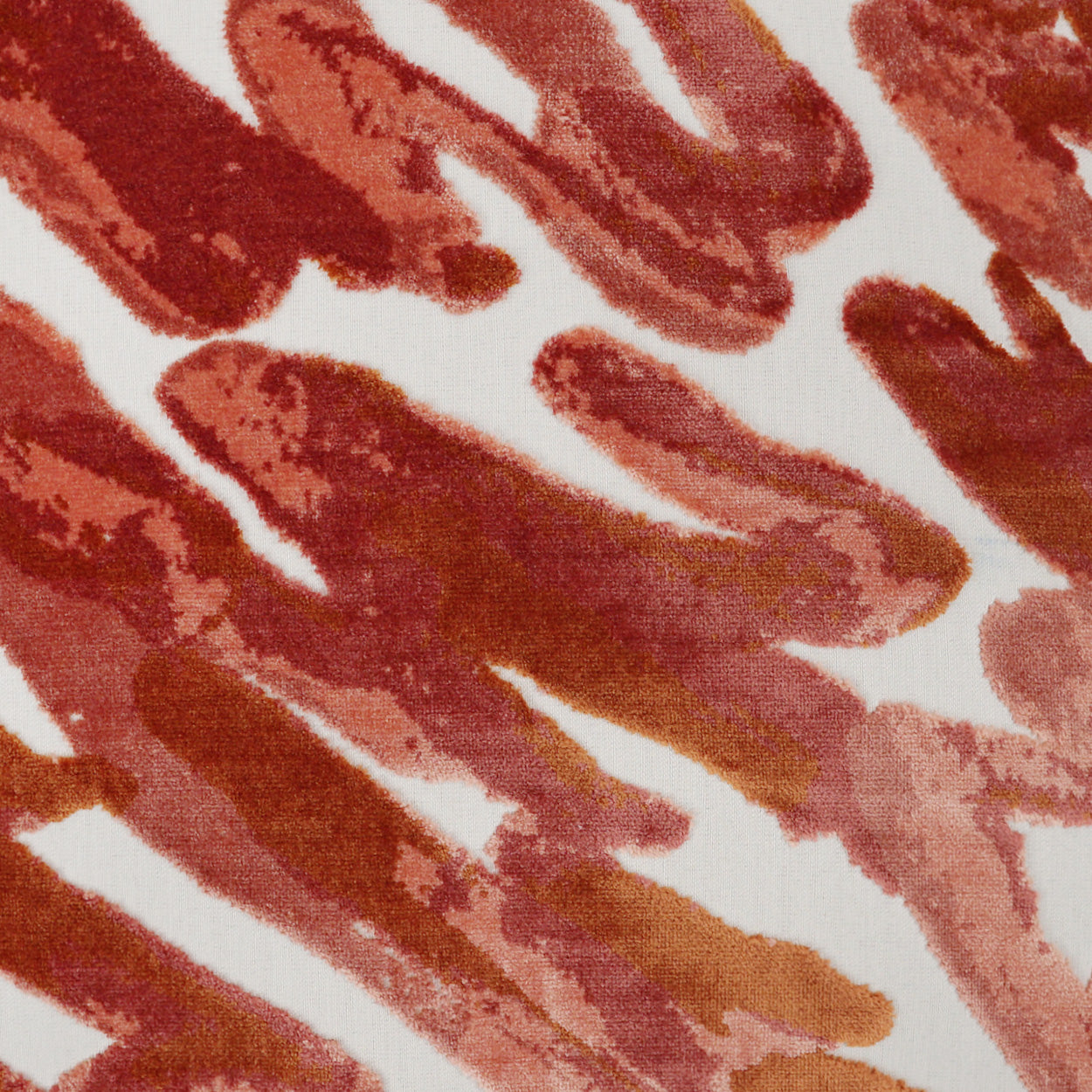 Earthy red-brown brushstroke pattern on white fabric; watercolor-style abstract textile print.