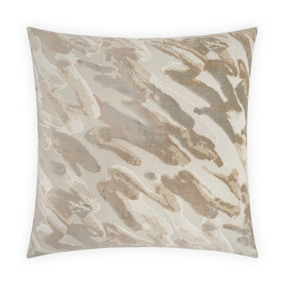 Square decorative pillow with beige, taupe and cream abstract brushstroke pattern and soft fabric.