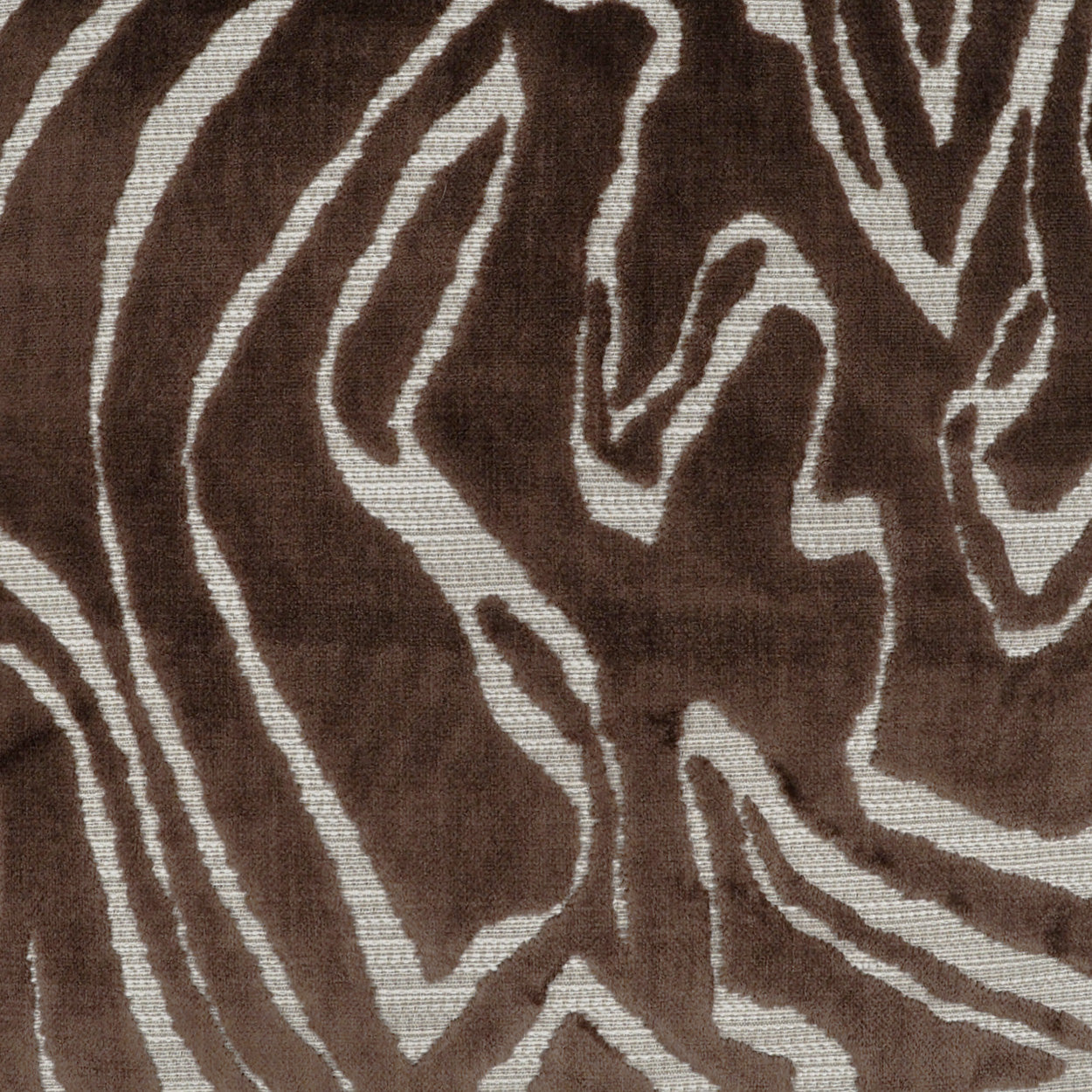 Brown and cream zebra-striped woven fabric with plush texture, suitable for rug or upholstery.