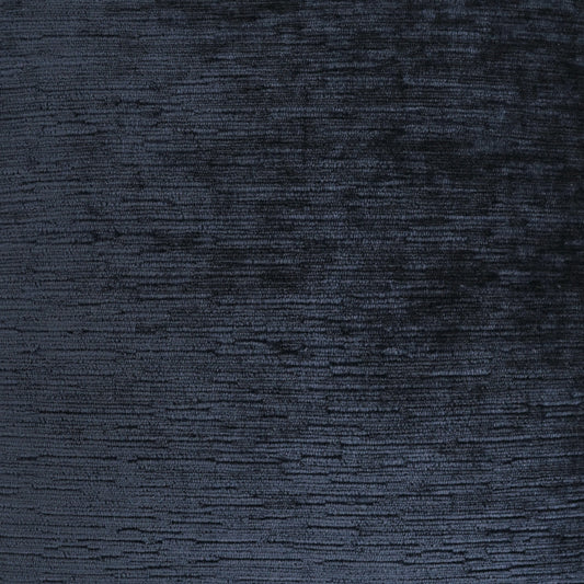 Dark navy velvet fabric close-up with rich sheen and subtle nap texture.