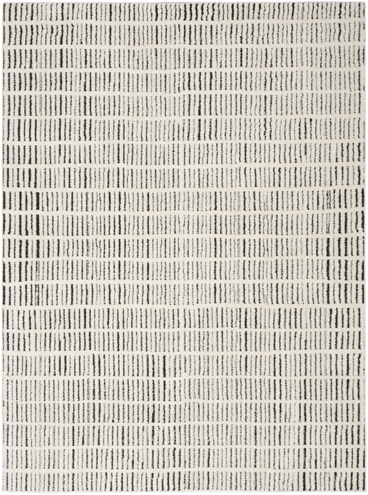 Beige rectangular rug with black dotted vertical stripes in repeated rows; modern geometric design.