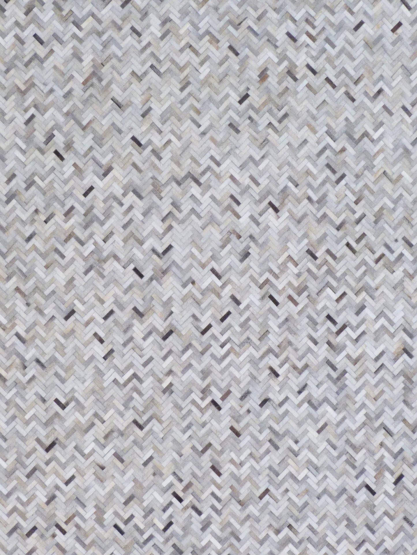 Neutral grey, white and beige mosaic leather rug, indoor hand-stitched with a textured geometric pattern.