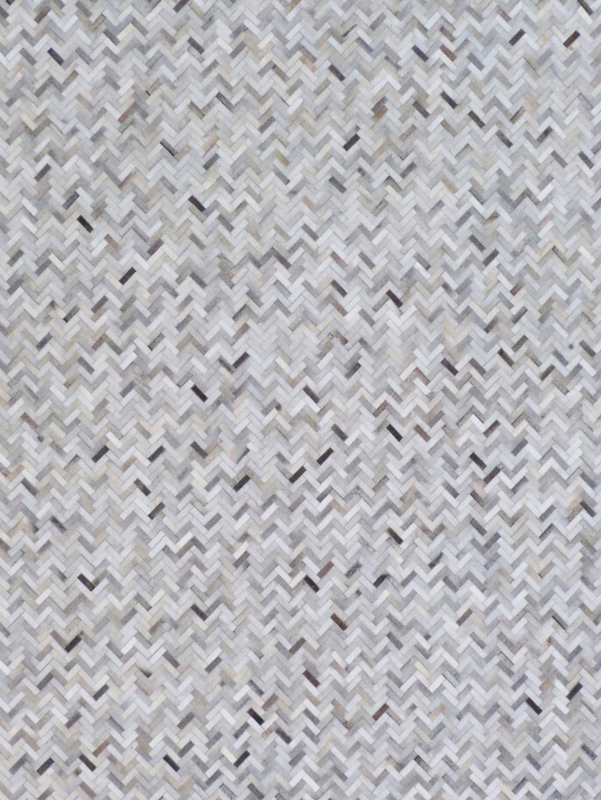 Neutral grey, white and beige mosaic leather rug, indoor hand-stitched with a textured geometric pattern.