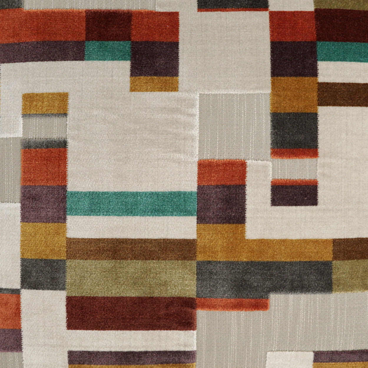 Abstract geometric woven fabric with beige background and multicolor blocks in orange, teal, mustard, brown, gray and purple.