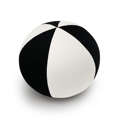 Round 12x12 inch pillow with black color-block design.