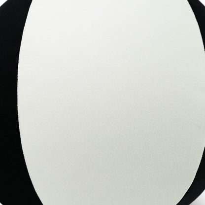 Cream fabric close-up with smooth, subtle texture against a black background.