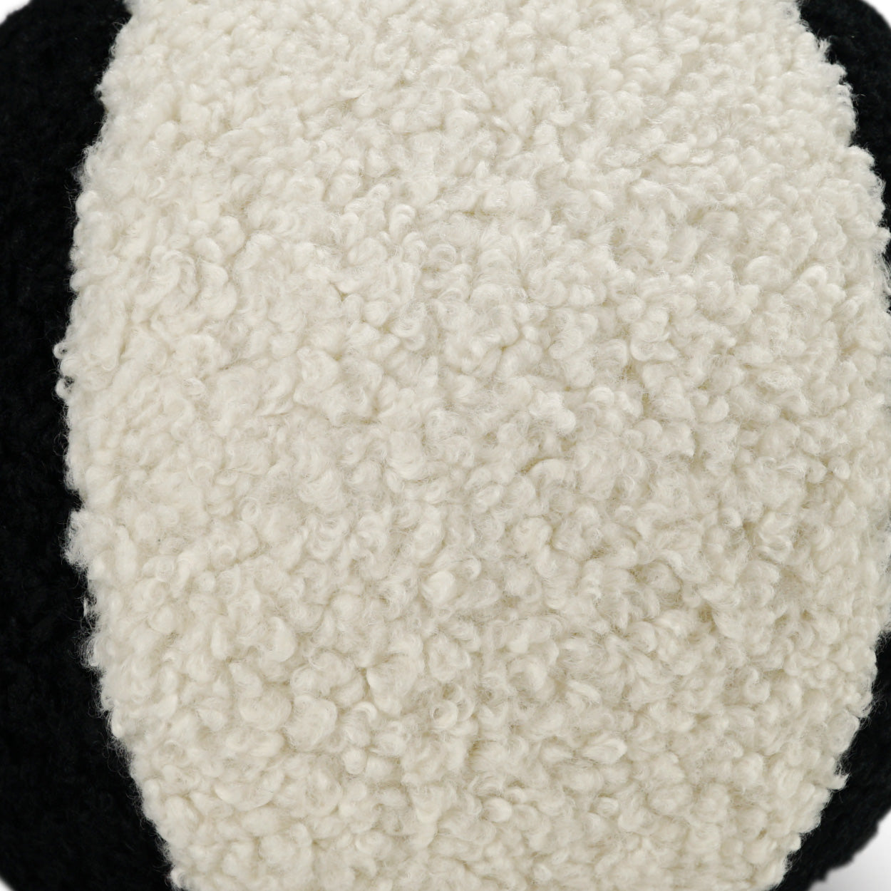 Ivory and jet faux fur pillow with fluffy texture; 12" x 12