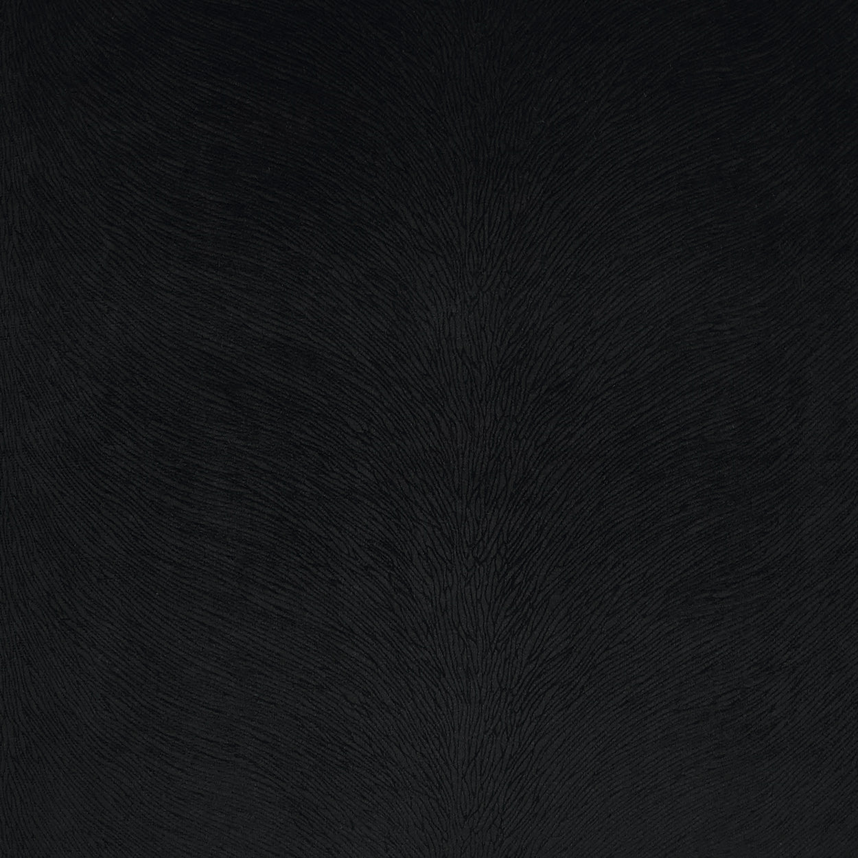 Dark charcoal fabric texture on a black solid pillow, close-up with fine nap and soft matte finish.