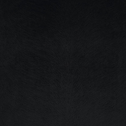 Dark charcoal fabric texture on a black solid pillow, close-up with fine nap and soft matte finish.