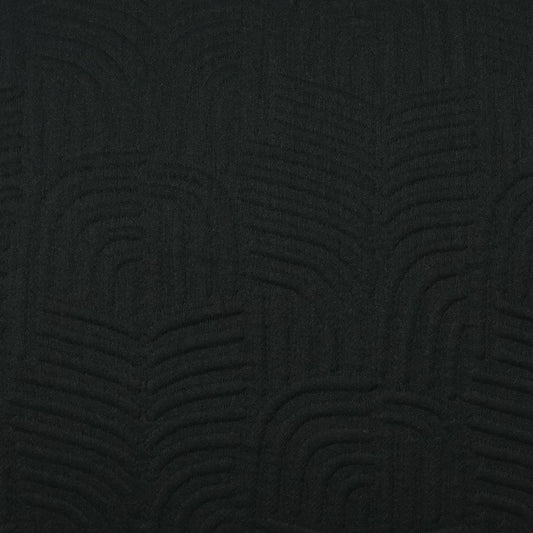 Dark charcoal fabric with subtle embossed arc pattern; tactile textile suitable for upholstery.