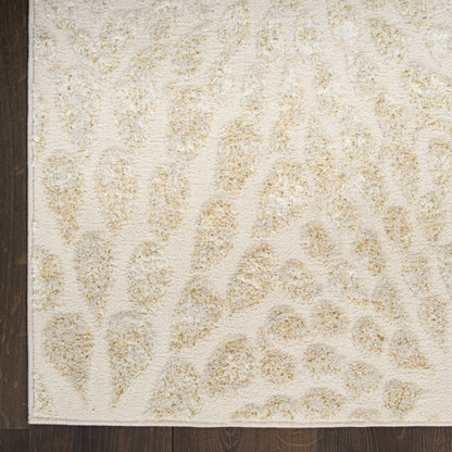 Beige animal-print area rug with low-pile texture, tan spots on ivory background, shown on dark wood floor.
