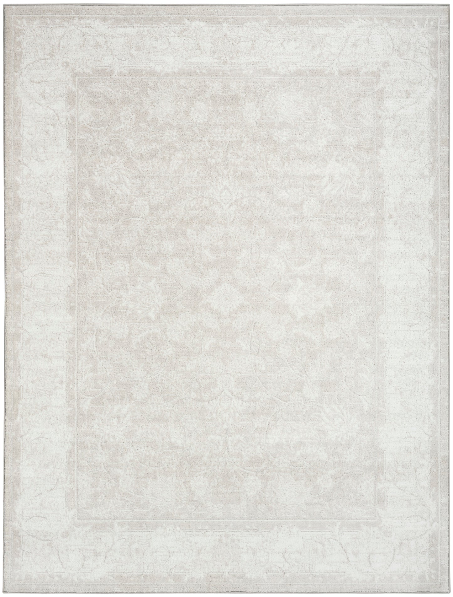 Ivory distressed oriental area rug with subtle floral medallion and faded border.