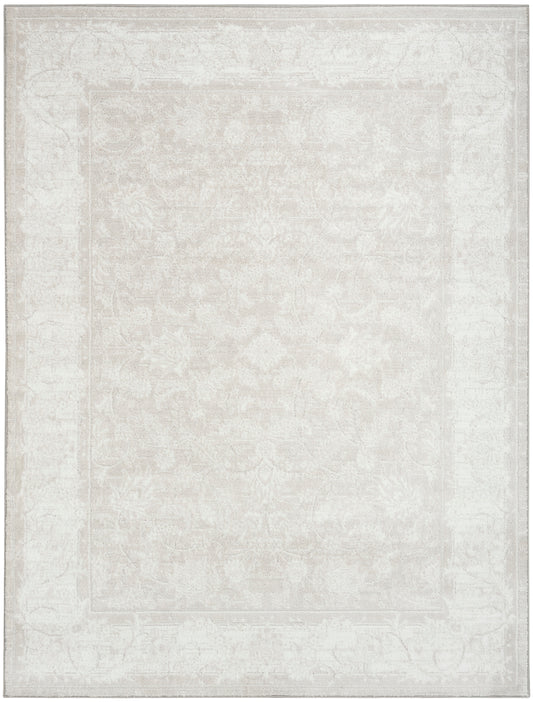 Ivory distressed oriental area rug with subtle floral medallion and faded border.