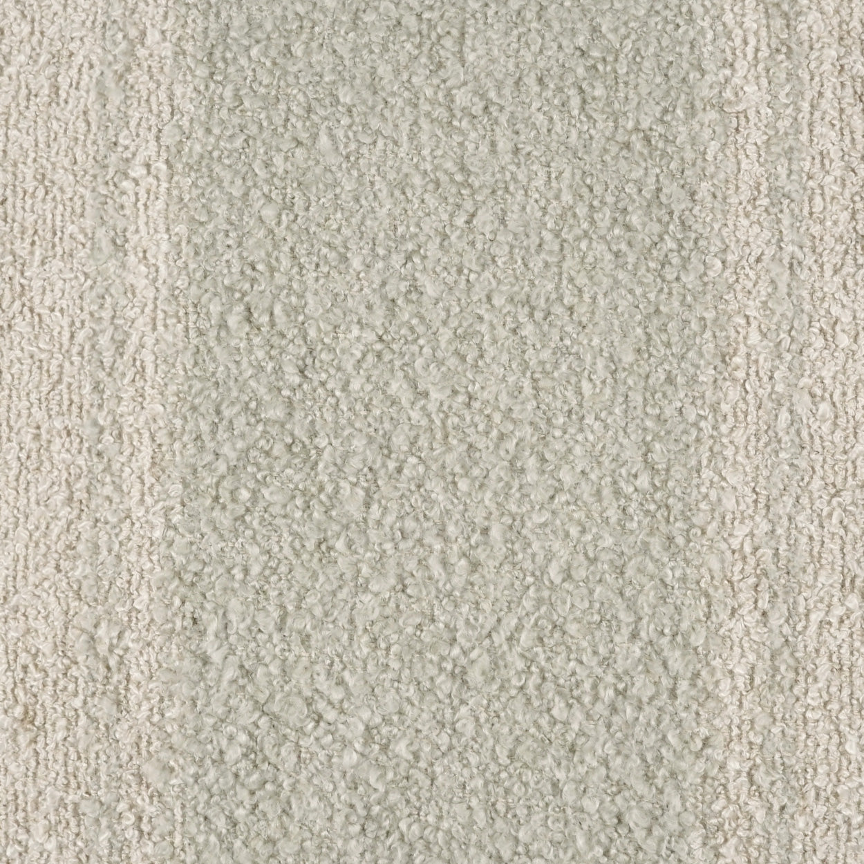 Beige boucle textured fabric close-up with loop pile; soft neutral upholstery or carpet material.