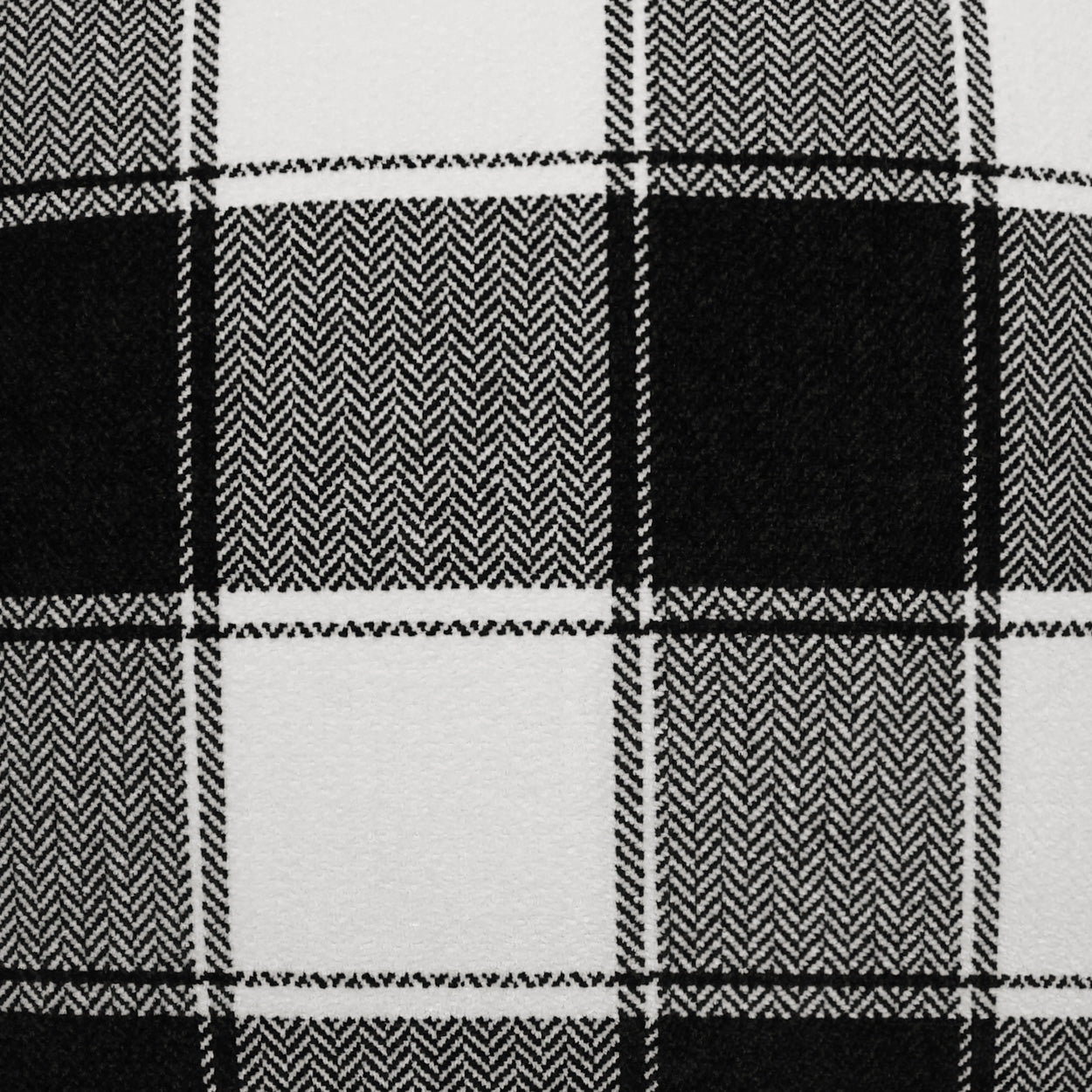Monochrome plaid fabric with herringbone weave in black and white squares.