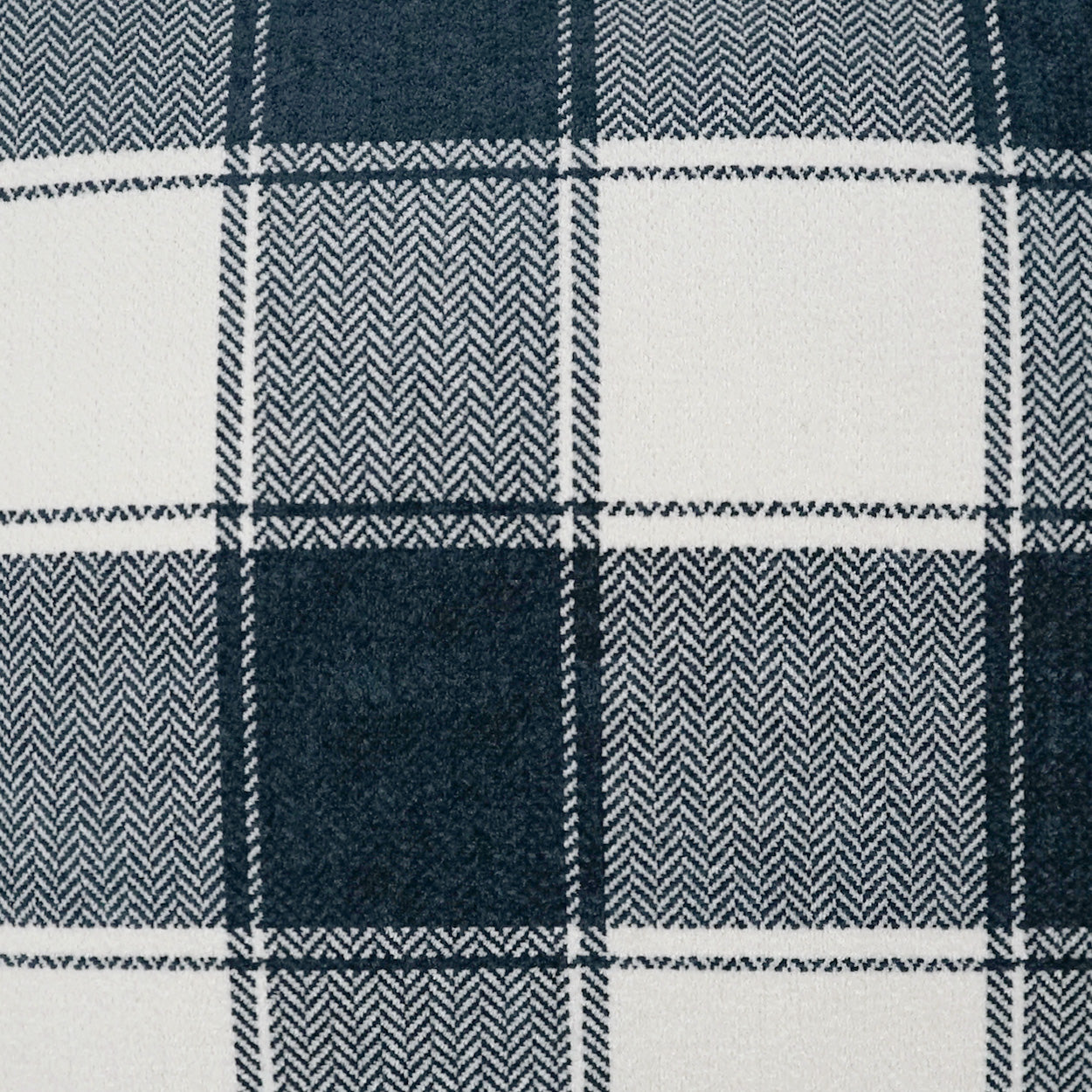 Navy and white plaid fabric with herringbone texture in square blocks, cozy wool-like material.