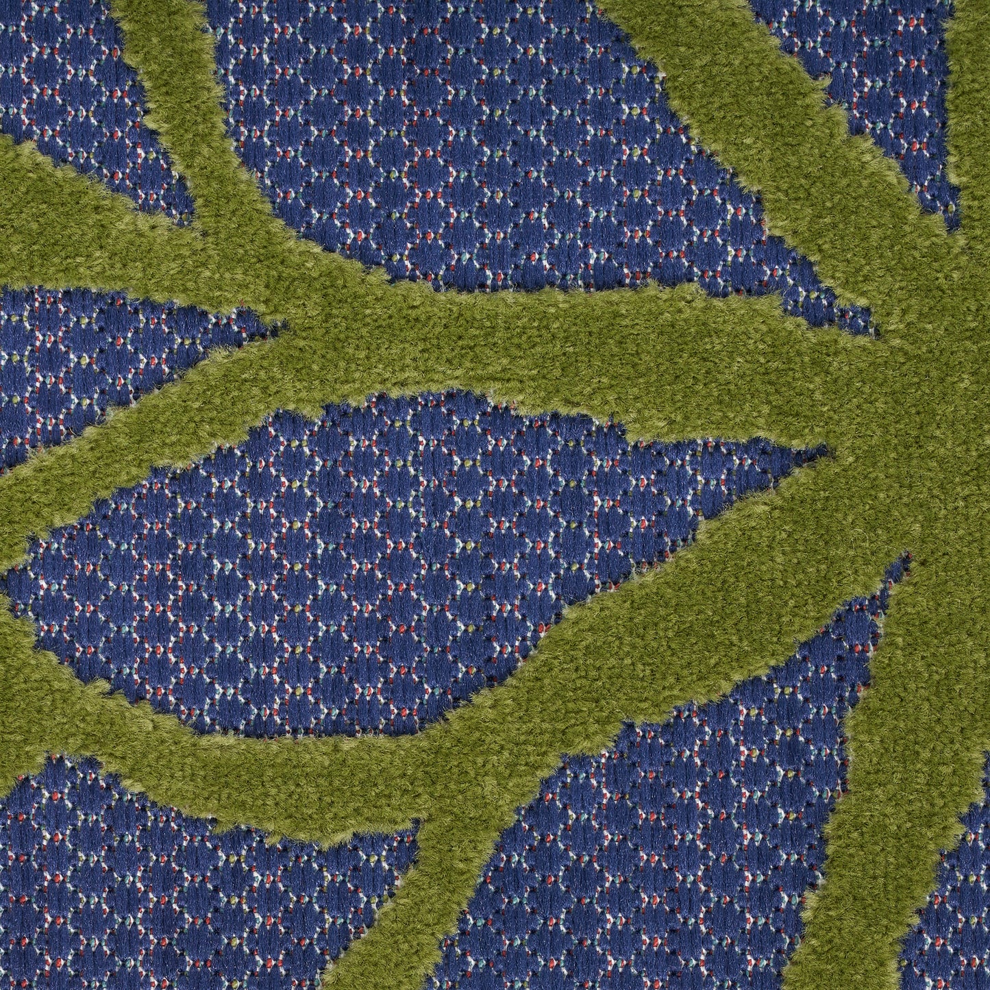 Blue textured carpet with olive-green raised leaf pattern, plush modern botanical design.