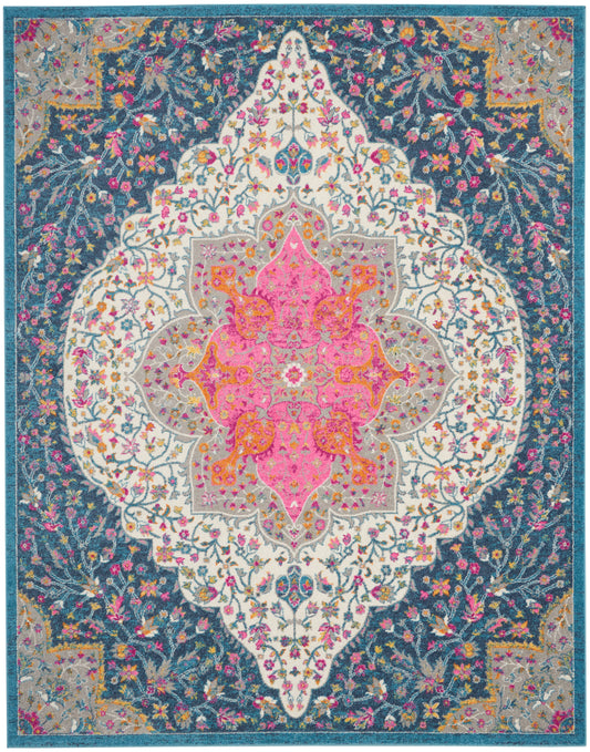 Farmhouse-style area rug with a vivid floral medallion: pink center, white lattice, teal field, gold and multicolor border.