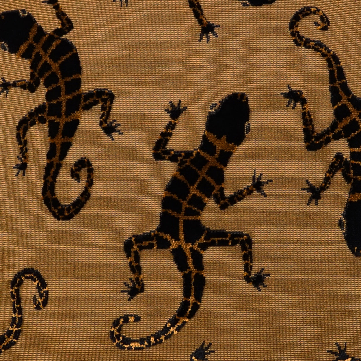 Beige woven fabric with black gecko silhouettes in a repeating tropical pattern; upholstery or decor textile.