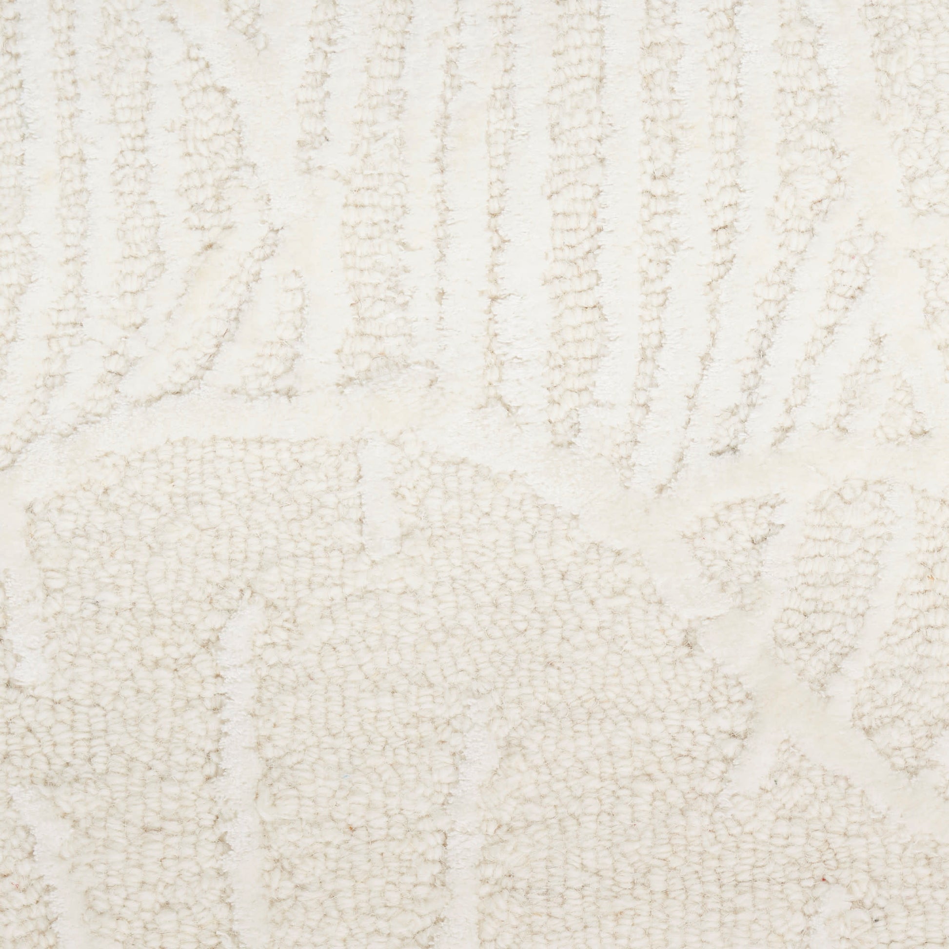Cream-toned textured rug with geometric pattern, loop-pile weave, soft beige for modern living spaces.
