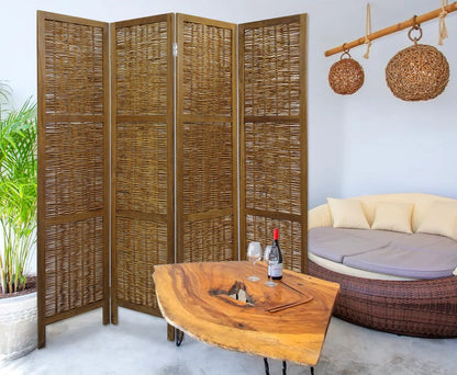 Four-panel woven rattan room divider with dark wood frame in a lounge beside a live-edge wood coffee table and wicker daybed.