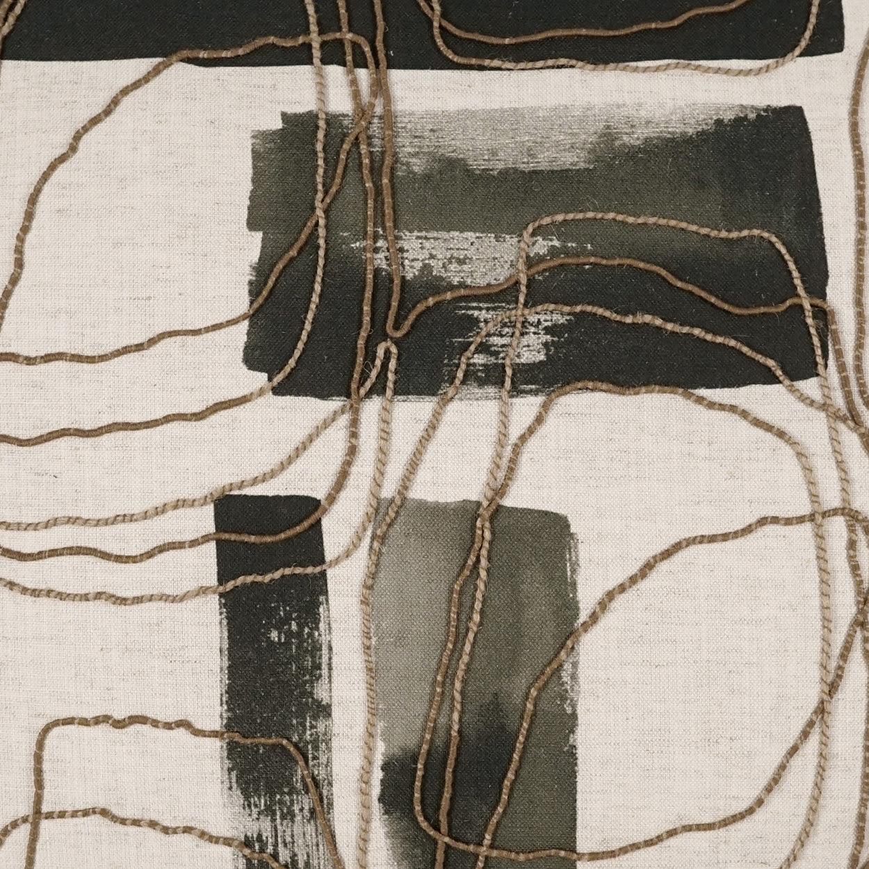 Beige linen textile with black abstract brushstrokes & tangled brown cord accents; modern wall hanging or throw.