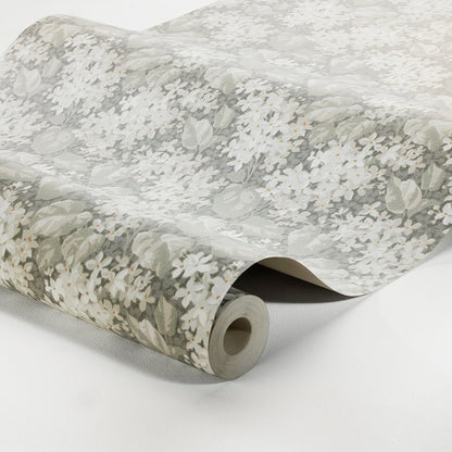 Wallpaper roll with pale gray and white floral print on a light neutral background.