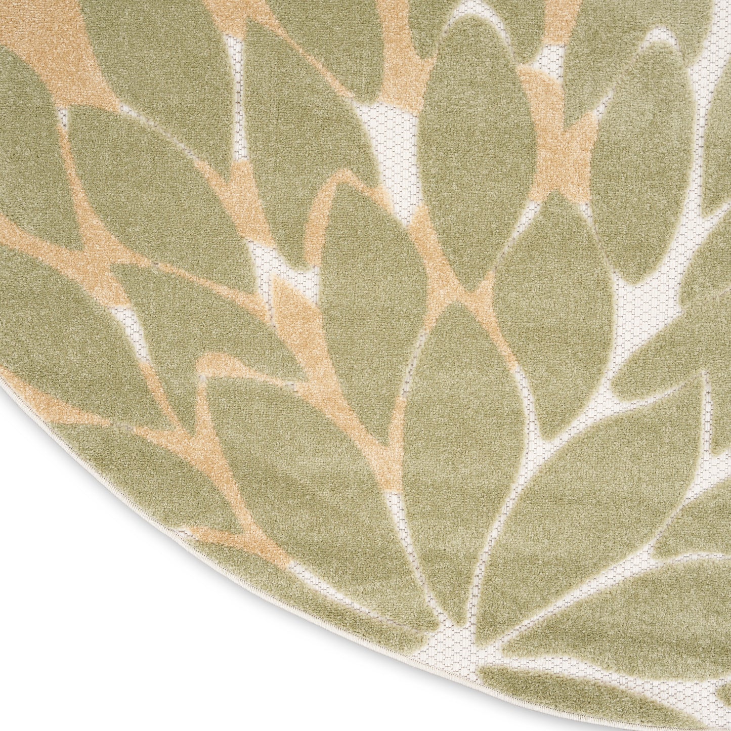 Close-up of a circular rug featuring olive-green leaves on a beige backdrop; soft, textured fabric.