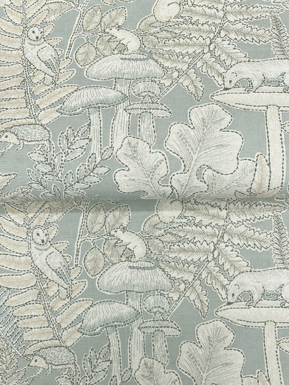 Pale blue-gray fabric with white line-drawn woodland mushrooms, ferns and leaves pattern.
