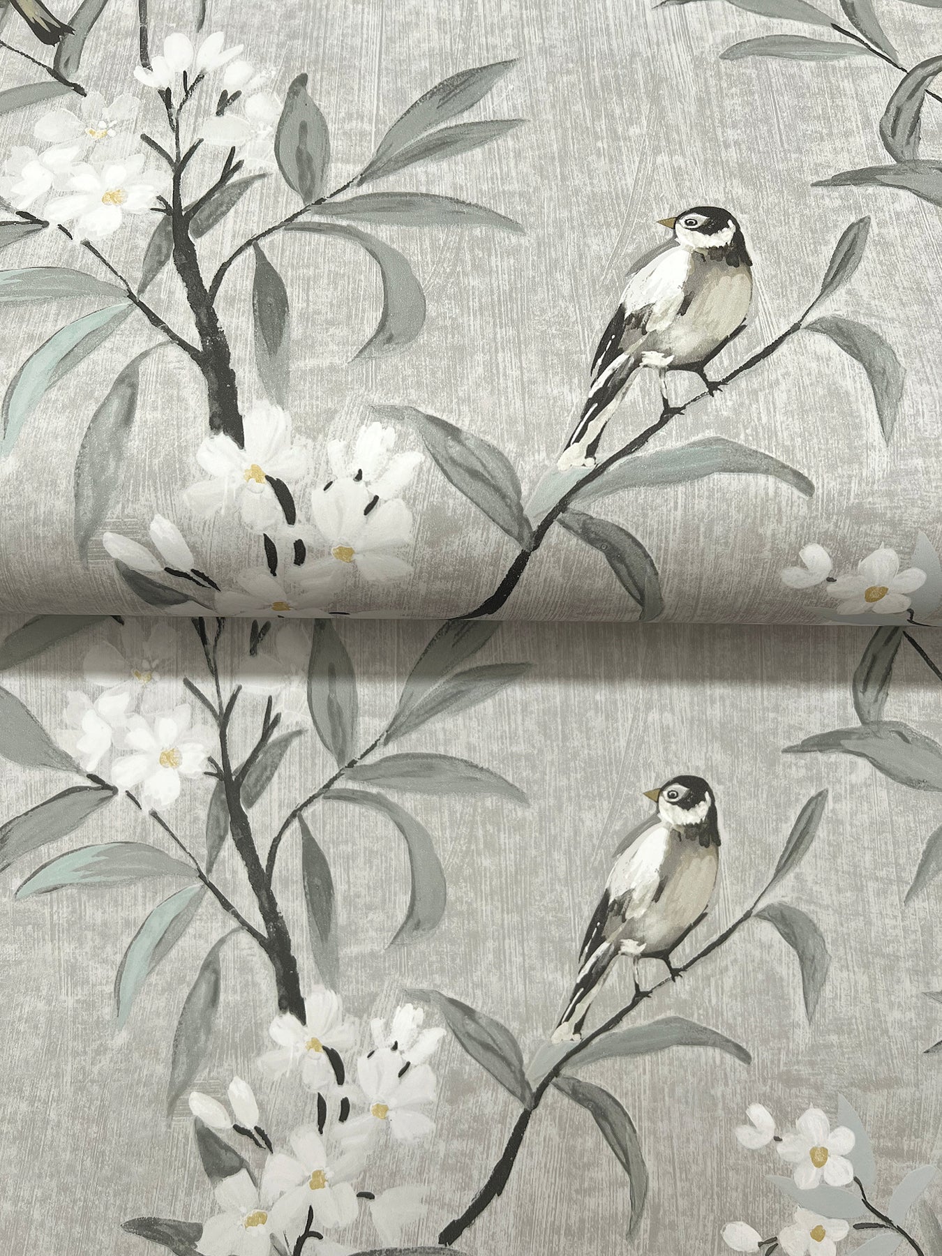 Gray wallpaper with watercolor-style branches, white blossoms, and small perched birds.