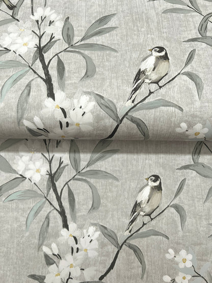 Gray wallpaper with watercolor-style branches, white blossoms, and small perched birds.