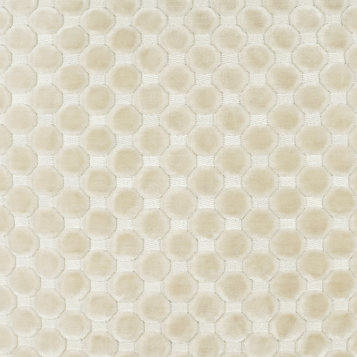 Cream-beige fabric with a subtle honeycomb pattern of rounded hexagons, repeating across.