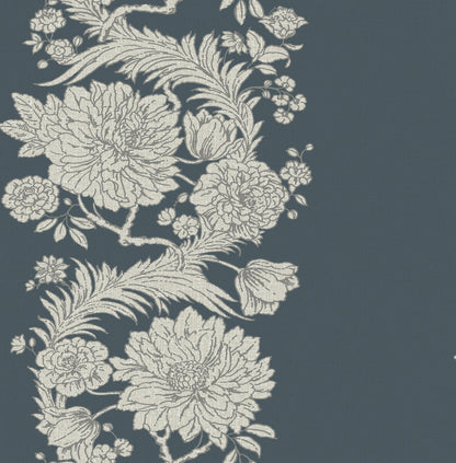 Cream peony blossoms with leaves in a floral damask pattern on a deep blue-gray background.