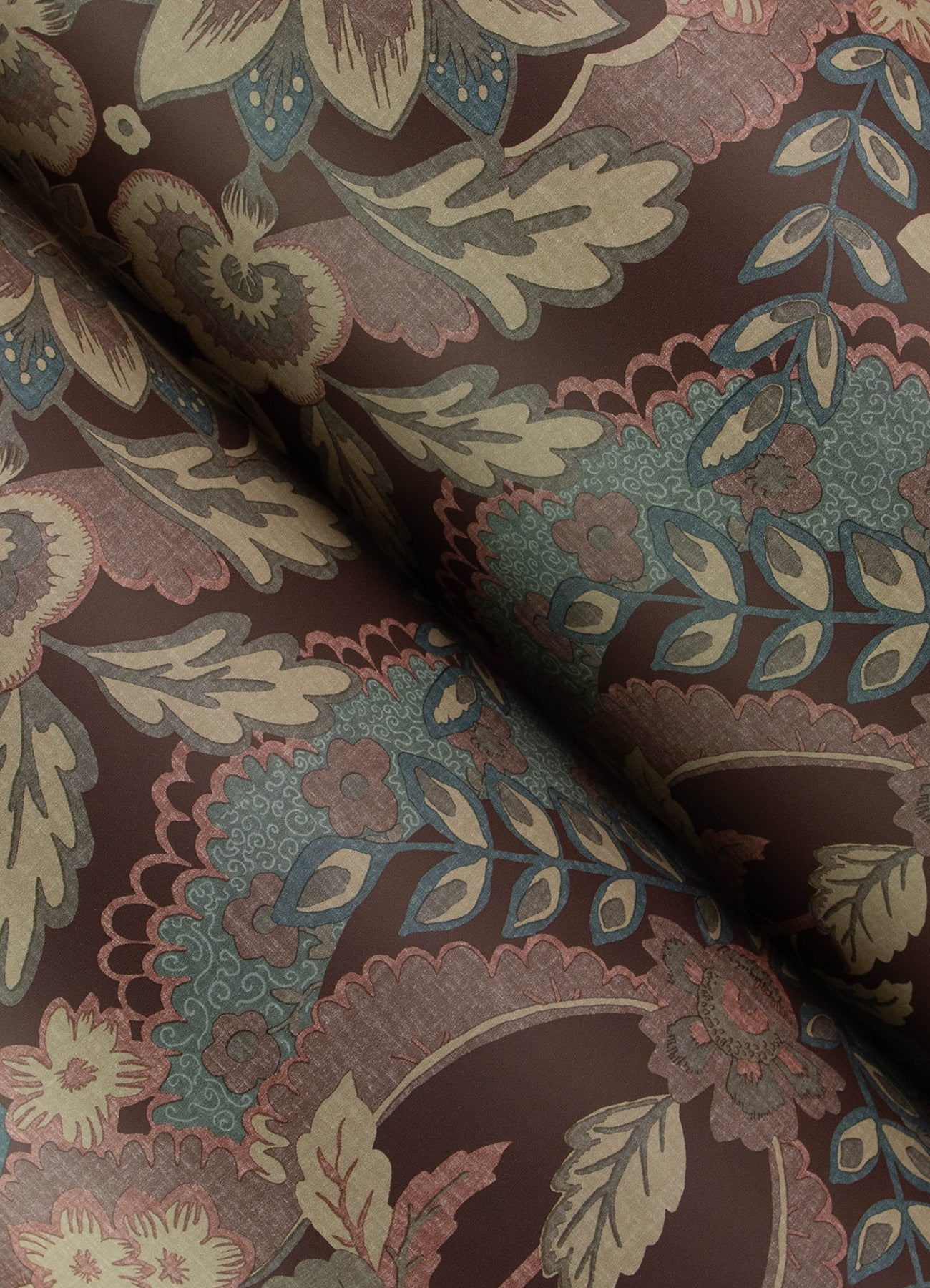 Decorative damask floral fabric with maroon base, beige leaves, teal and blue accents, ornate scrolling.