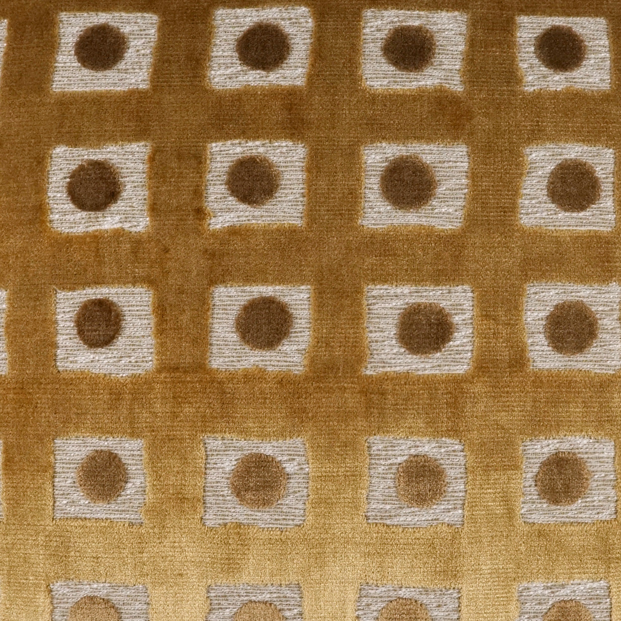 Warm brown fabric with a grid of light beige squares, each centered by a brown dot, retro geometric textile pattern.