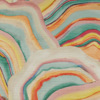 Soft fabric with wavy rainbow stripes in pastel pink, peach, orange, yellow, teal and mint.