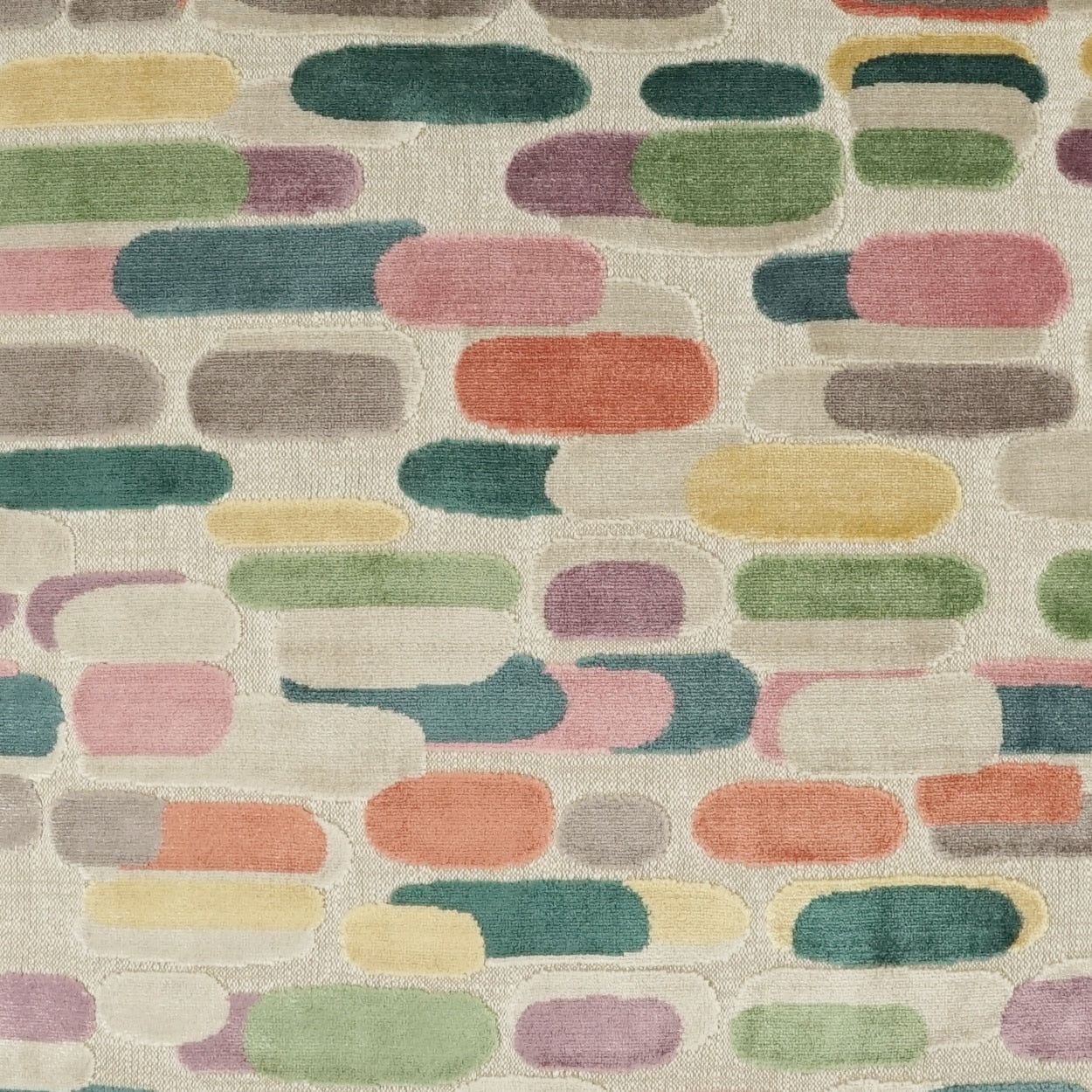 Pastel color-blocked fabric pattern with rounded capsule shapes in greens, pinks, yellows, and blues on a beige background.