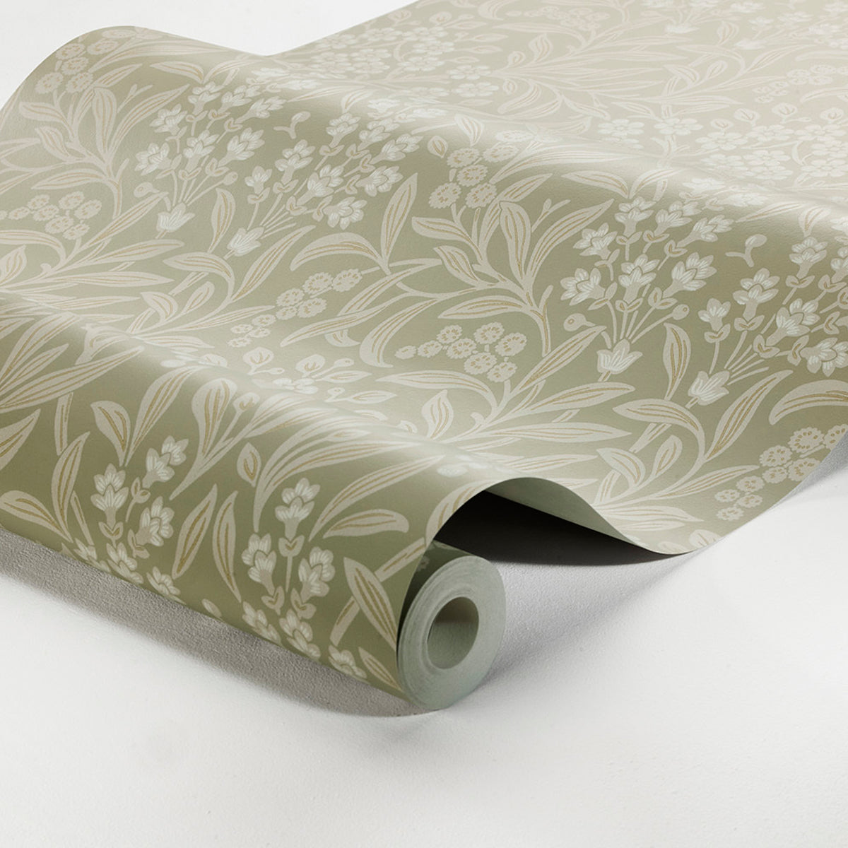 Beige wallpaper roll with white floral leaf pattern, rolled at the edge, soft satin finish.