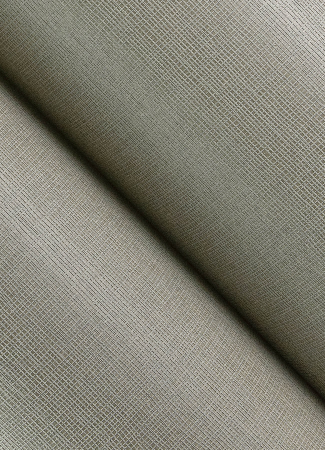 Beige textured woven fabric close-up with fine grid pattern; soft upholstery or apparel material.