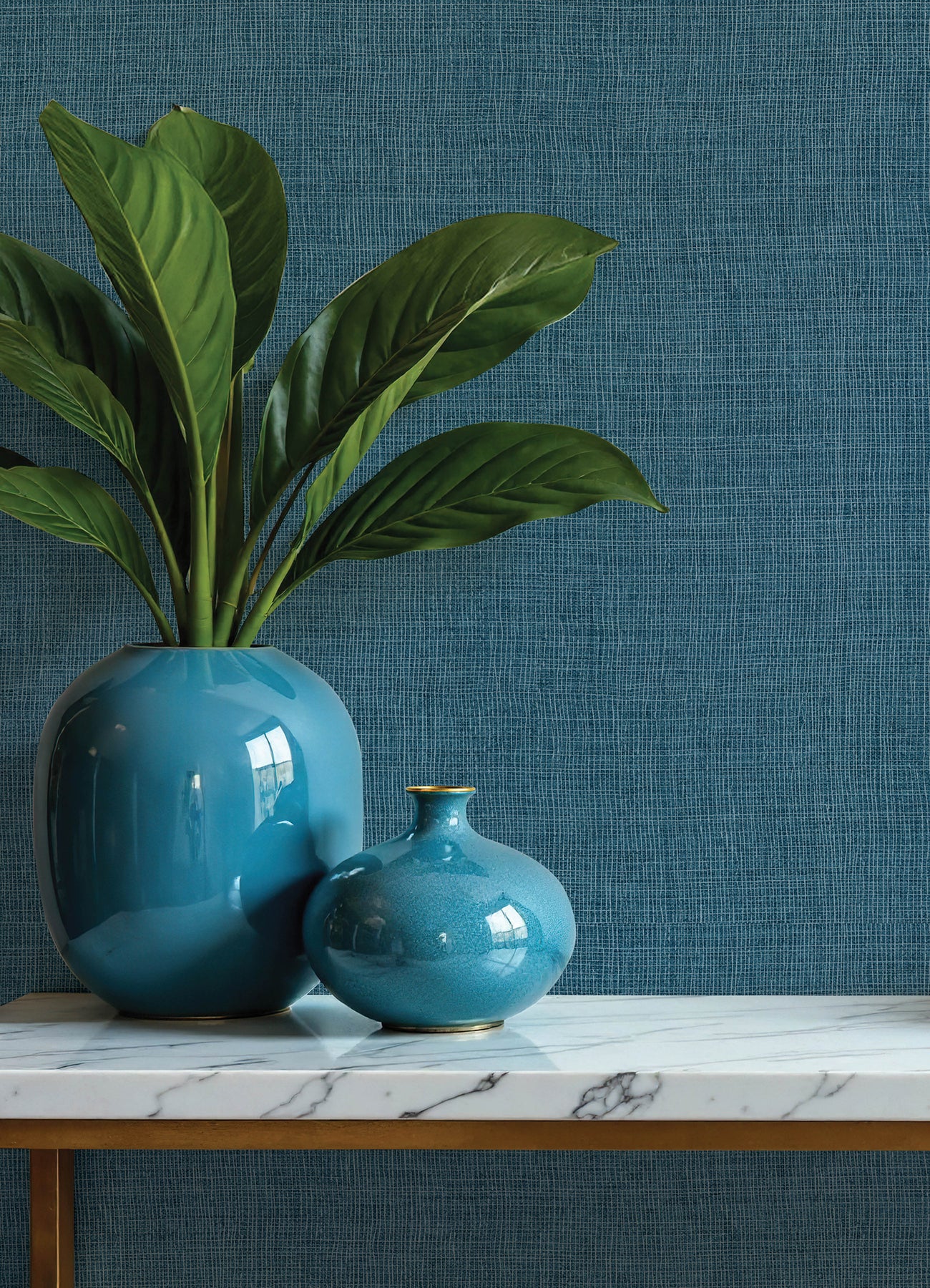 Dark blue open-weave wallpaper with a subtle textured pattern on the wall.