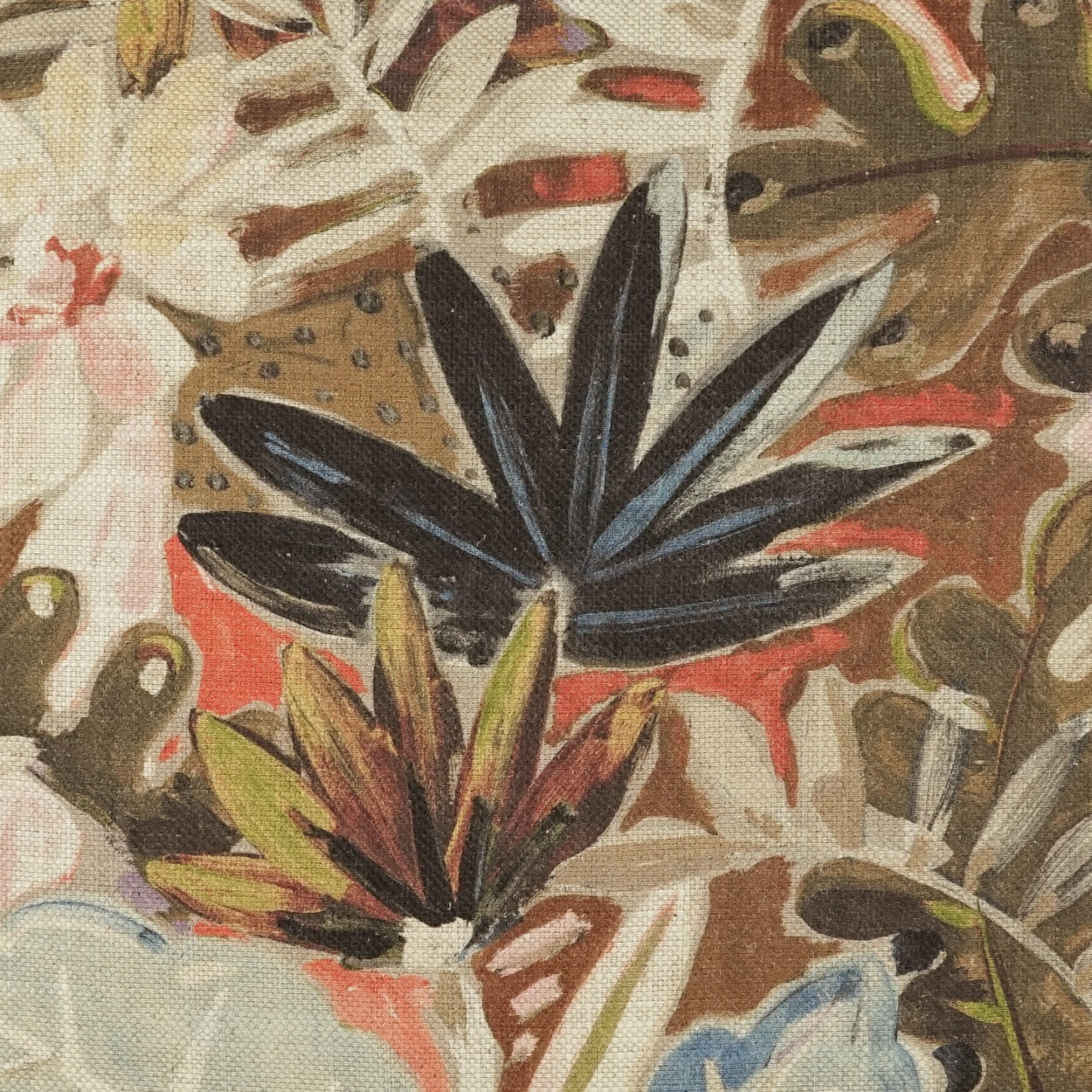 Abstract botanical fabric print with a bold dark blue leaf motif and olive, brown, and red accents on a tan background.