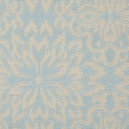 Soft blue and ivory damask-patterned woven fabric with floral motifs; decorative upholstery or drapery textile.