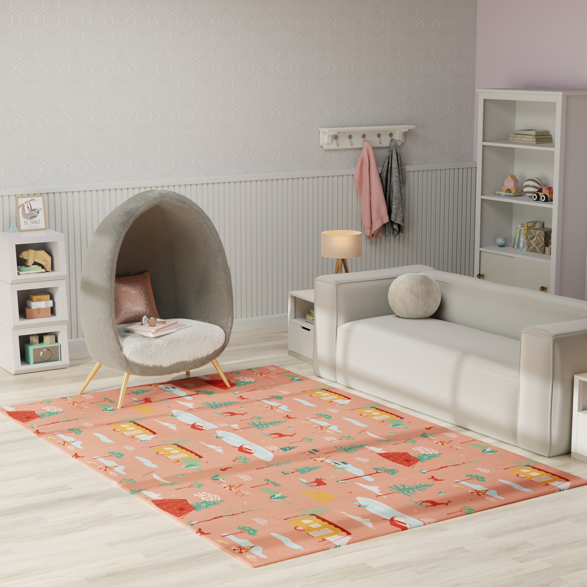 Pastel kids' living room with coral rug featuring houses, grey cocoon chair, white sofa, light wood floor.