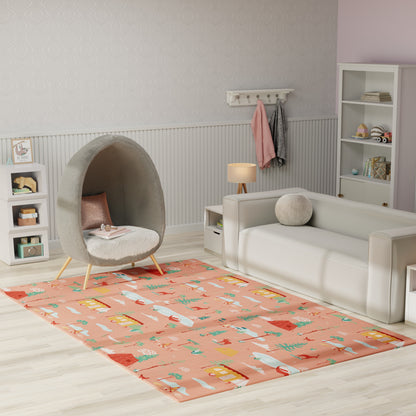 Pastel kids' living room with coral rug featuring houses, grey cocoon chair, white sofa, light wood floor.