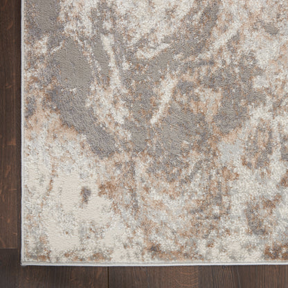 Neutral abstract-pattern area rug in beige, taupe, gray with cream accents; low-pile with a subtle border.