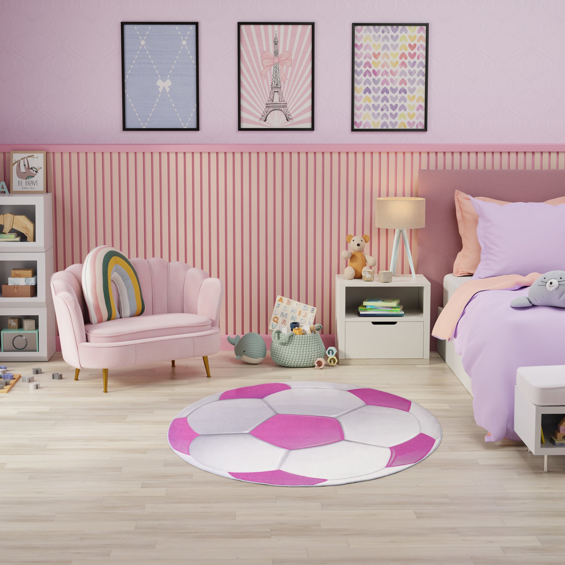 Pastel pink kids' room with round pink-white rug, pink armchair, lavender bedding, striped wall paneling.
