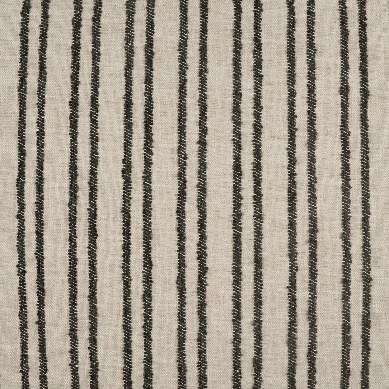Beige fabric swatch with smooth plain weave; neutral square against a striped rug edge.