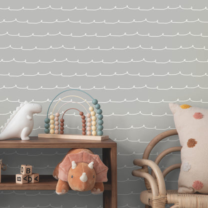 Whimsical grey stripe wallpaper with wiggle-line graphics.